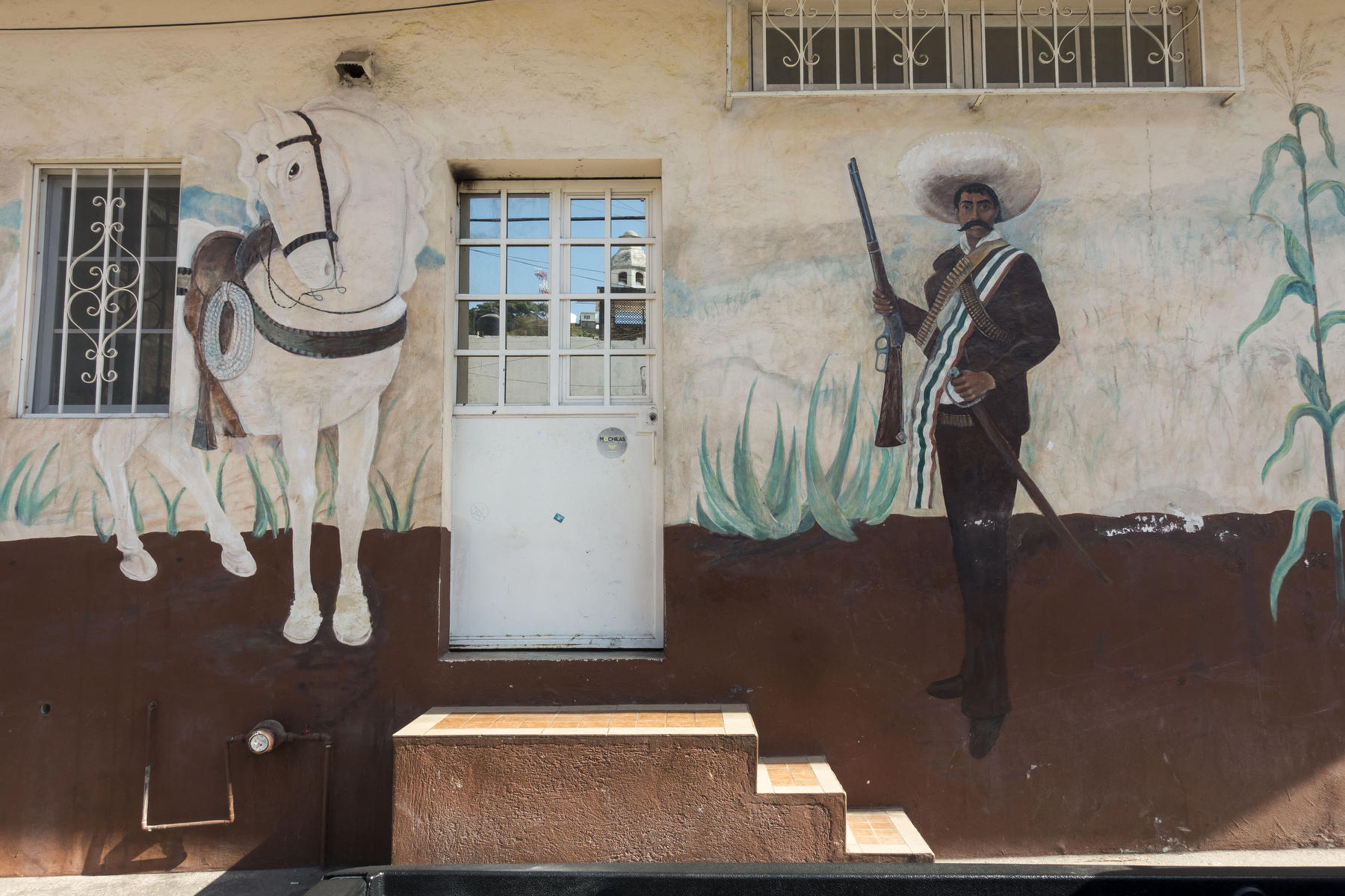 General Pancho Villa and his horse Seven Leagues painted on the side of a house in Old Town. : PUERTO VALLARTA - Wall Art & Bicycle Tour : Viviane Moos |  Documentary Photographer