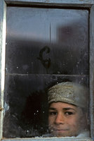 A passing bus window. Peshawar, Pakistan - © Viviane Moos