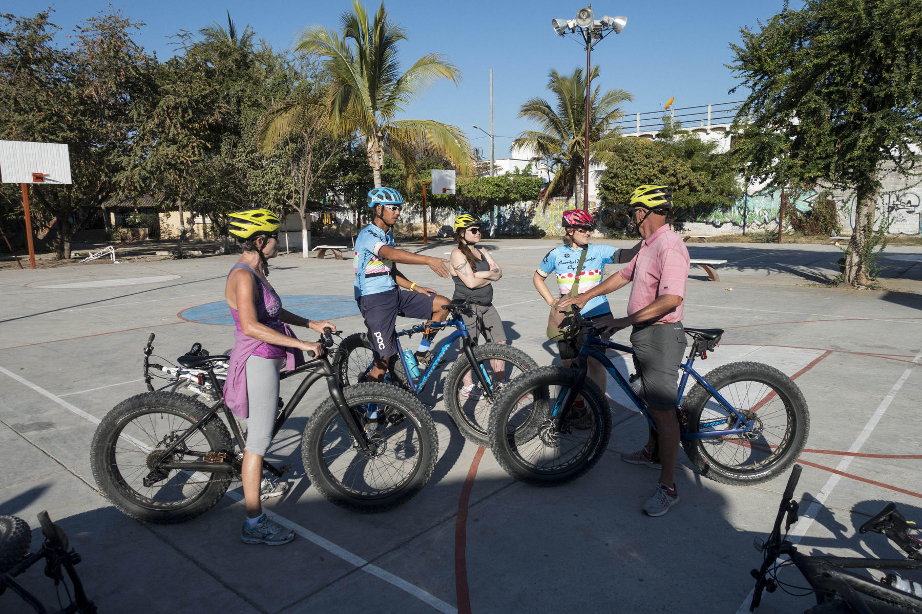 Bicyclists take a photography break  : PUERTO VALLARTA - Wall Art & Bicycle Tour : Viviane Moos |  Documentary Photographer