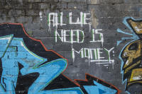 Graffiti quote that is part of a Gangster tag mural. All We need is Money. - © Viviane Moos