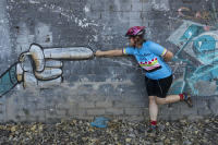 Carmen, owner of Puerto Vallarta Cycling, connecting  with a  painted pug dog's finger
 - © Viviane Moos